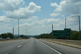 Interstate 565 directly replaced Andrew Jackson Way (Old U.S. 72) from Chapman Mountain southwest to Oakwood Avenue / Exit 20. Portions of the original road remain in service as local frontage roads.