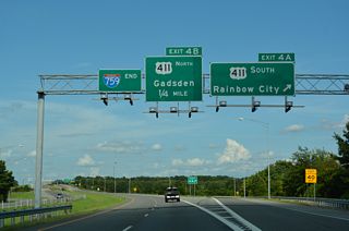 Exit 4 A joins I-759 with U.S. 411 (Rainbow Drive) southbound into Rainbow City. Like Interstate 759, Rainbow Drive travels a causeway across H. Neely Henry Lake. Downtown Rainbow City lies 3.3 miles to the southwest.