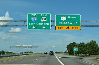 Exit 4 B loops onto U.S. 411 (Rainbow Drive) northbound where Interstate 759 transitions to SR 759 east. U.S. 411 follows Albert Rains Boulevard along the Coosa River into Downtown Gadsden.The previous overheads here did not omit the  exit tab for 4 B.