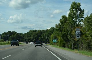 A truck shield for SR 291 precedes the intersection with George Wallace Drive.