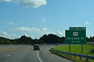 A six-ramp parclo interchange joins SR 759/I-759 with U.S. 411 (Rainbow Drive) at Exits 4 A/B. U.S. 411 follows Albert Rains Boulevard south from Downtown Gadsden along the Coosa River to Rainbow Drive and H. Neely Henry Lake.