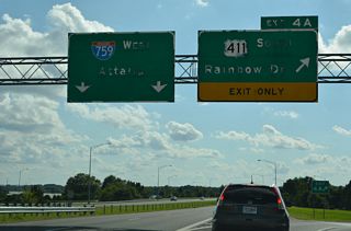 Exit 4 A loops onto U.S. 411 (Rainbow Drive) southbound. Rainbow Drive straddles H. Neely Henry Lake on a narrow causeway between Gadsden and Rainbow City. The US highway meets SR 77 (Grand Avenue) 3.7 miles to the south.