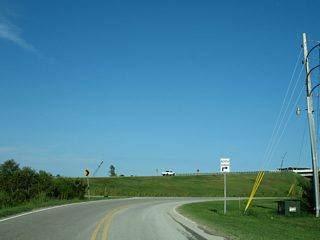 Brown Lane loops under the Foley Beach Express toll bridge and connects with the northbound side of the expressway.