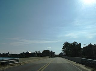 Leaving the intersection with CR 4 (Oyster Bay Road), CR 6 spans Oyster Bay and reaches Plash Island. The span was rebuilt in 1997.