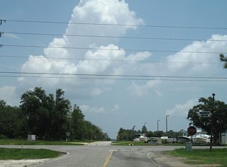 Still not a signalized intersection as of 2009, CR 8 crosses SR 59 and continues east toward several new subdivisions carved out of former farm fields to the end at the Foley Beach Express.
