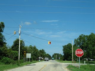 CR 10 east converges with CR 10 (Bon Secour Highway) northbound at this stop sign.