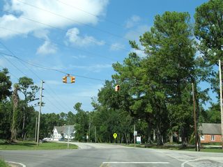 An older set of 20" flashers advised caution to CR 10 motorists at the stop sign for CR 49 South.