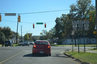 This set of truck trailblazers directed motorists east along Rev. Abraham Woods, Jr. Boulevard (8th Avenue N) east for U.S. 11 and 280 and west for U.S. 31. 8th Avenue North is the historic alignment of U.S. 78 between Arkadelphia Road and 24th Street in Downtown Birmingham.