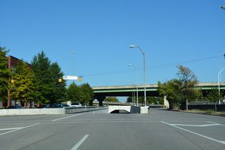 5th Avenue switches to two-way traffic beyond 25th Street N as it lowers through a tunnel below 26th Street N