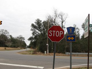 Howells Ferry Road continues east from CR 5 and 74 to a dead end at Big Creek Lake. CR 5 leads south to Tanner Williams and north to U.S. 98 at Wilmer.