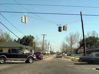 Vintage signals along Congress Street east at Kennedy Street. Converted to a four-way stop, these signals flashed red. They were eventually replaced with a double red flasher.