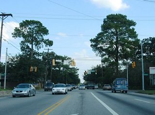 The landscaped median of Dauphin Street gives way to a center turn lane east from Sage Avenue to Florida Street. Florida Street is another secondary arterial linking U.S. 98 (Spring Hill Avenue) with U.S. 90 (Government Street) through Midtown Mobile.
East from the at-grade crossing with the Norfolk Southern Railroad, Dauphin Street transitions into residential areas.
