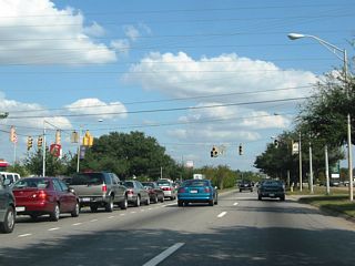 Dauphin Street intersects Northgate Drive along a commercialized stretch east of I-65. A tree lined median separates traffic along Dauphin Street between McGregor Avenue and Sage Avenue.