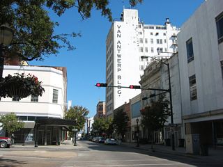 Dauphin Street east at Saint Joseph Street in the LoDa (Lower Dauphin Street Entertainment District). LoDa is an area of Downtown populated by bars, night clubs and other social gathering points.