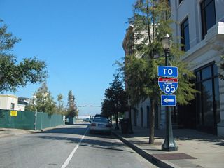 Interstate 165 trailblazer posted near the east end of Dauphin Street and across from the then-RSA Tower construction site.