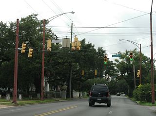 A staggered intersection links Dauphin Street with Carlen Street. Carlen Street connects with adjacent Old Shell Road and residential areas to the south.