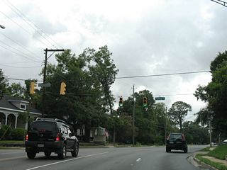Dauphin Street bends northward at the intersection with Fulton Street. Fulton Street heads south from Old Shell Road to Old Government Street.