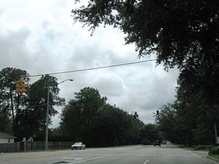 Rimes Road ties into Dauphin Street from Springhill College and Spring Hill Golf Course. The road connects with parallel Claridge Road North on the south side.