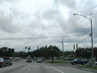 Serving an array of businesses, West I-65 Service Road leads north to Spring Hill Avenue and south to Airport Boulevard.