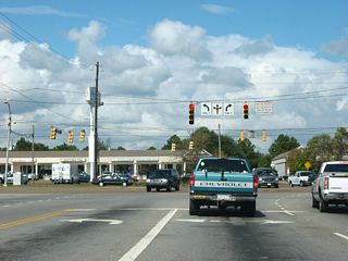 Montlimar Drive north at Airport Boulevard. Airport Boulevard maintains six through lanes with two service roads between I-65 and Azalea Road / McGregor Road.