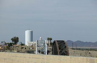 The southern bridge is the original, single lane U.S. 80 crossing over the Colorado River. The words &quot;Ocean to Ocean Highway&quot; and &quot;Yuma&quot; are written on the side of the span.