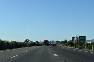 Big box stores and other retail line the east side of Interstate 8 between the exchange with U.S. 95 and the forthcoming weigh station.