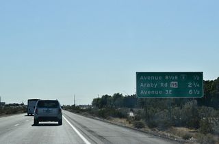 Shifting north of the Union Pacific Railroad, the subsequent exit beyond Business Loop I-8 is for SR 195 (Araby Road) south.