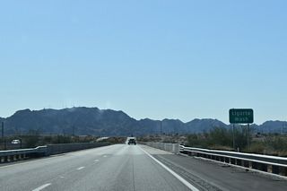 Interstate 8 spans Ligurta Wash south of the Lugurta Foothills community ahead of mile marker 24.