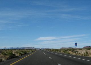 The Cerbat Mountains appear on the far northern horizon beyond this confirming marker.