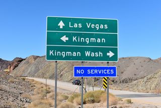 The old alignment of U.S. 93 ties into the exchange at Exit 2 on the west side. However the old road to Hoover Dam is not open to the public.