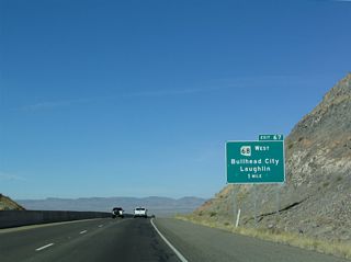 Lowering from Coyote Pass, U.S. 93 meets SR 68 west at a trumpet interchange (Exit 67) in one mile.