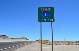 Future Interstate 11 corridor sign posted along U.S. 93 south of the entrance ramp from Kingman Wash Access Road.