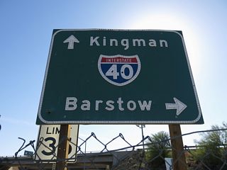 J Street heads southwest from Business Loop I-40/Historic U.S. 66 (Broadway Street) a tenth of a mile to the diamond interchange along I-40/U.S. 95 at Exit 142.