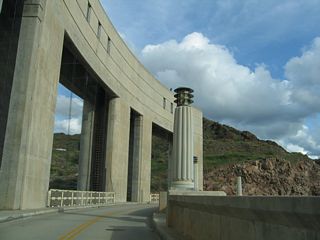 Curving east across the Colorado River, Parker Dam Road enters the state of Arizona midway across Parker Dam.