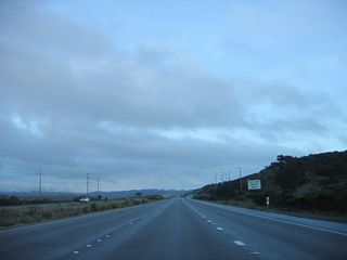 SR 135 continues south with two lanes beyond the exit ramp taking SR 1 southwest across Vandenburg Space Force Base and San Antonio Valley.