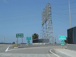 California 1 (Pacific Coast Highway) passes over California 103 (Terminal Island Freeway) on a bridge built in 1948. The Terminal Island Freeway is an example of older freeway infrastructure that has not been extensively modified since its original construction.