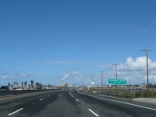 After crossing the Santa Ana River, northbound California 1 (now known as Pacific Coast Highway once again) enters the city of Huntington Beach, "Surf City USA." Incorporated on February 17, 1909, Huntington Beach had a population of 202,566 as of the 2010 Census. With wide, sandy beaches and a vibrant downtown area adjacent to a fishing pier, Huntington Beach attracts beachgoers and tourists from all over Southern California.