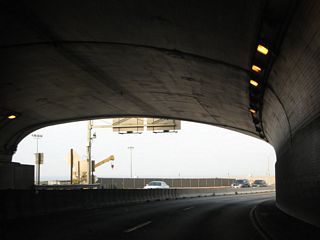 After passing through the Palisades, the McClure Tunnel brings SR 1 (Pacific Coast Highway) alongside the beach in Santa Monica.