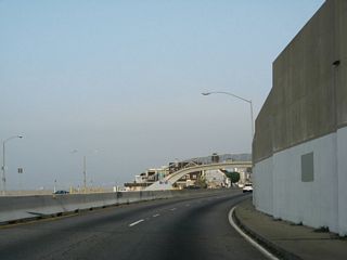 California 1 turns from west to north and continues between the beach and the Palisades.
