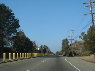 Plastic pylons separate traffic along California 1 (Pacific Coast Highway) at Meadows Court.