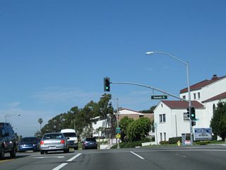 The next signalized intersection on California 1 north is with Emerald Street.