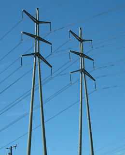 Towering 220kV Southern California Edison transmission lines cross over the Pacific Coast Highway in northern Redondo Beach. These lines transmit electricity generated by the AES California power plant. 1350 megawatts of electricity is generated by steam heated by natural gas.