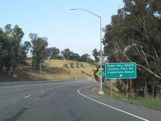 Northbound California 1 meets Exit 1, Doheny Park Road to Coast Highway south and the community of Capistrano Beach (part of the city of Dana Point). Stay left for the coastal route to Dana Point, Laguna Beach, Newport Beach, and Huntington Beach.