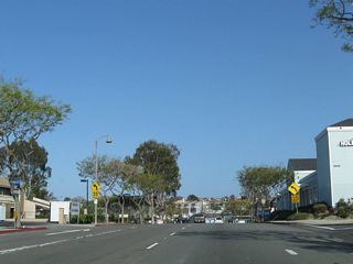 The former one-way Coast Highway westbound through Downtown Dana Point. Conversion of Coast Highway to two-way traffic was completed on September, 2014. With shops and restaurants lining both sides, the locally maintained road is now a landscaped four-lane boulevard.