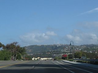 Ritz Carlton Drive loops west to the Ritz Carlton Hotel and Salt Creek Beach Park as the Coast Highway continues north by Sea Terrace Community Park to the Dana Point community of Monarch Beach.