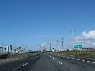 The next signalized intersection along California 1 (Pacific Coast Highway) north is with Brookhurst Street, which travels north to Fountain Valley. Brookhurst Street travels north parallel to the Santa Ana River toward a junction with Interstate 405.