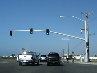Northbound California 1 (Pacific Coast Highway) meets Newland Street at this traffic signal.
