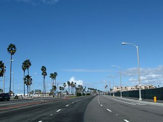 Leaving the Huntington Street intersection (home of the Ultimate Challenge statue), northbound California 1 (Pacific Coast Highway) proceeds into downtown Huntington Beach.
