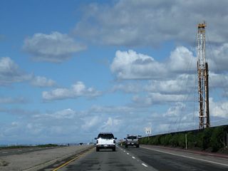 Between Golden West Street and Seapoint Avenue, California 1 passes by an oil field on the right and more beaches on the left.