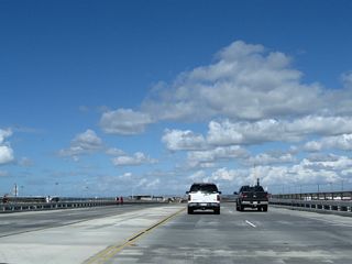 After the intersection with Seapoint Avenue, California 1 enters the Bolsa Chica State Beach and Bolsa Chica Ecological Reserve. This bridge crosses over water that connects the lagoon with the ocean.